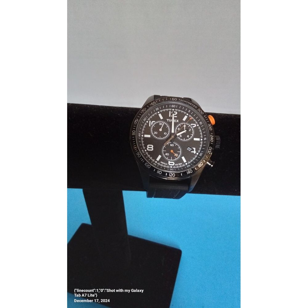 Sleek Black Chronograph Sports Watch With Tachymeter Bezel And Orange Accent